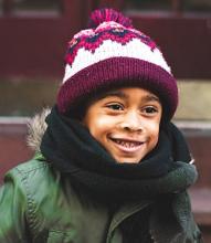 child wearing a winter hat and coat
