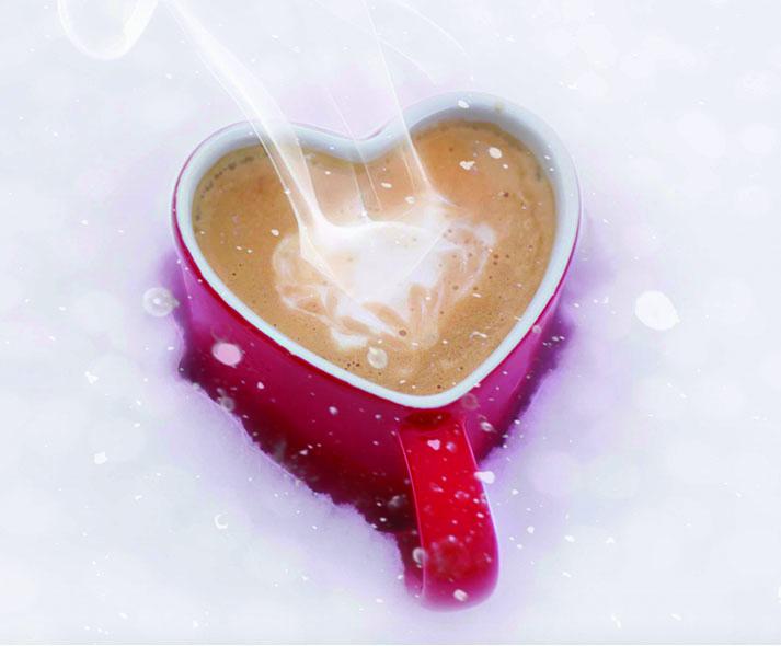heart shaped mug of hot chocolate