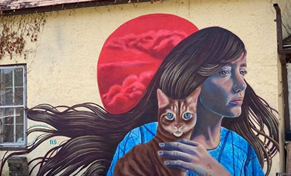 mural of a woman and a cat