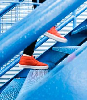 orange shoes going up stairs