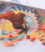 colorful mural of a Black woman