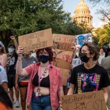 Pro-choice protesters march outside the Texas State Capitol
